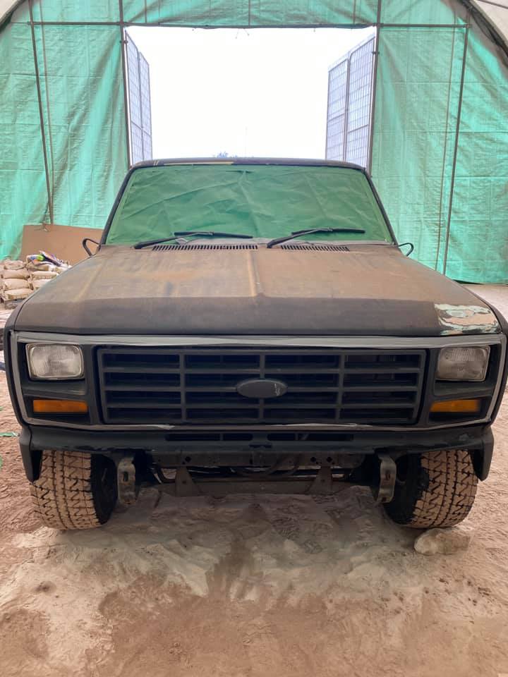 The blasting process of removing layers of paint and bog from a ford f100